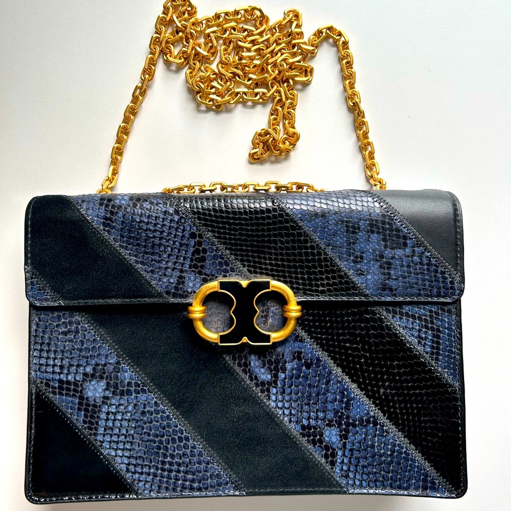 Beautiful Tory Burch crossover bag with gold chain.